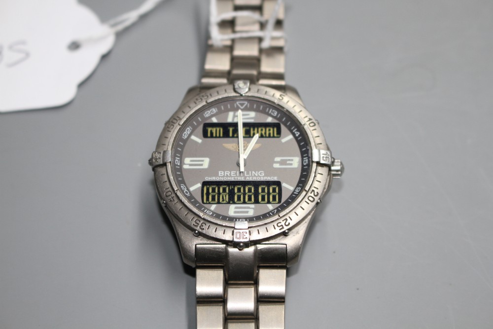 A gentlemans steel Breitling Aerospace quartz wrist watch, on Breitling bracelet.